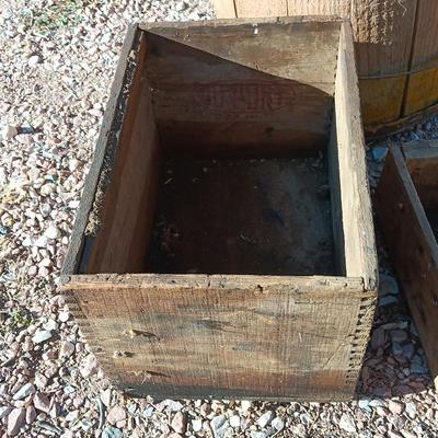 Two wooden rustic boxes and a wooden barrel for display
