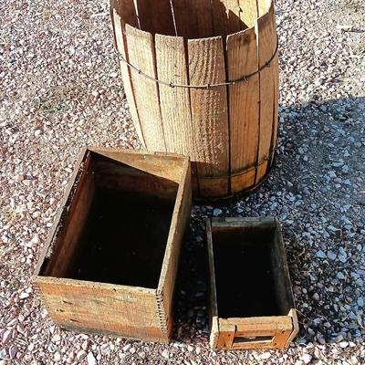 Two wooden rustic boxes and a wooden barrel for display