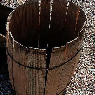 Two wooden rustic boxes and a wooden barrel for display