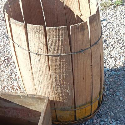 Two wooden rustic boxes and a wooden barrel for display