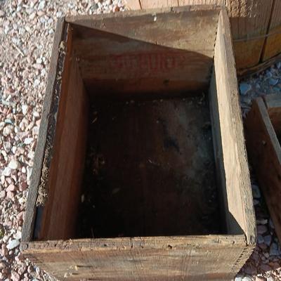 Two wooden rustic boxes and a wooden barrel for display