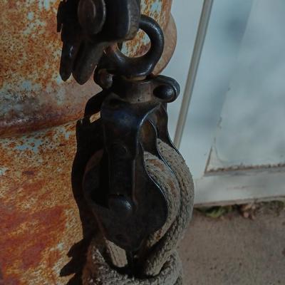 Metal Conoco barrel and a unique steel antique pully / block and tackle