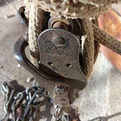 Metal Conoco barrel and a unique steel antique pully / block and tackle