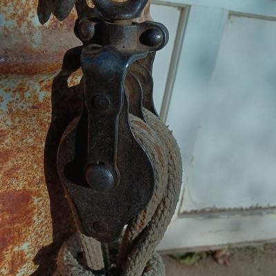 Metal Conoco barrel and a unique steel antique pully / block and tackle