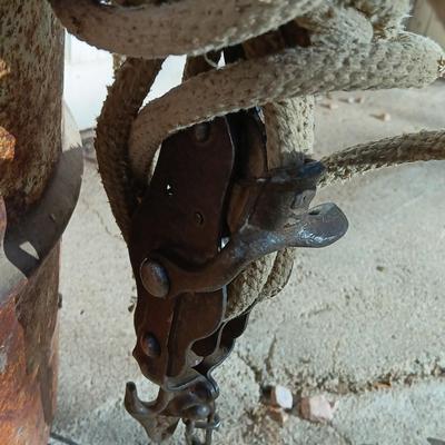 Metal Conoco barrel and a unique steel antique pully / block and tackle