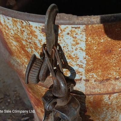 Metal Conoco barrel and a unique steel antique pully / block and tackle