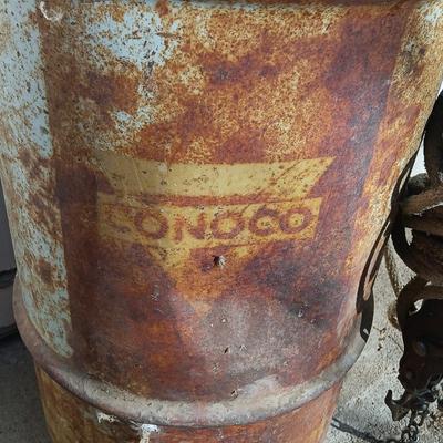 Metal Conoco barrel and a unique steel antique pully / block and tackle