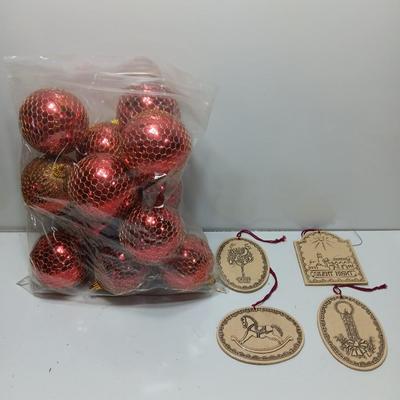 Christmas bulbs in gold colored netting and 4 ceramic ornaments