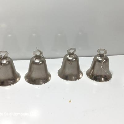 Four working metal bells