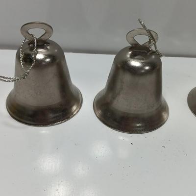 Four working metal bells