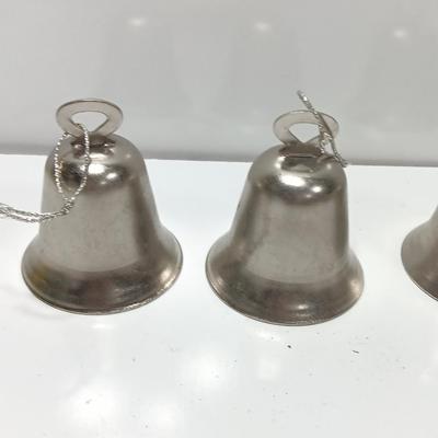 Four working metal bells