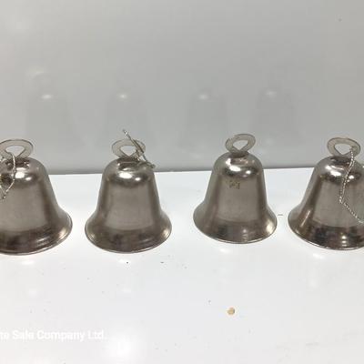 Four working metal bells