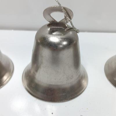 Four working metal bells