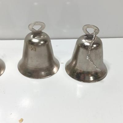 Four working metal bells