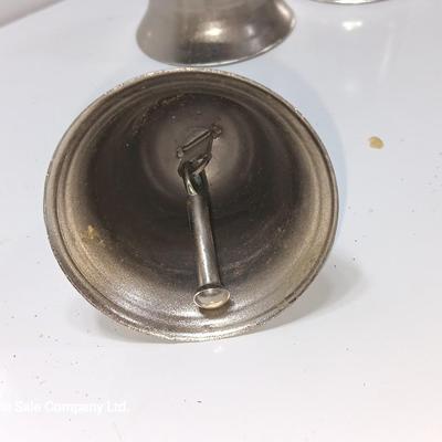 Four working metal bells