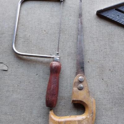 Assortment of tools - saws, wire cutters- clamp locking pilers - square and stapler