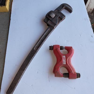 Large sized pipe wrench and a riveting tool