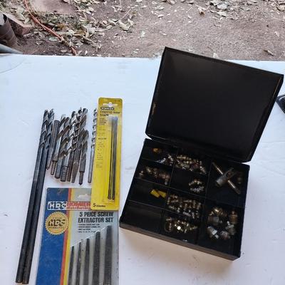 Assortment of drill bits and valves for tires
