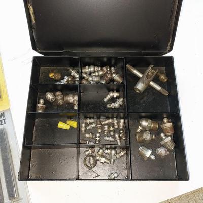 Assortment of drill bits and valves for tires