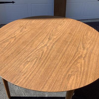 Wooden round table with vinyl top 30"H 41"diameter 10.5" leaf
