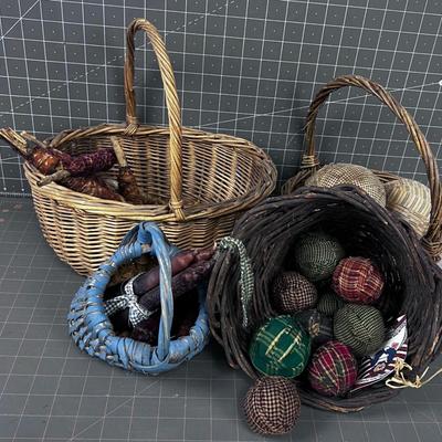 Decorative Baskets with: Balls, Candle and Fabric. 