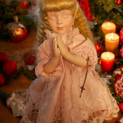 PRAYING DOLL