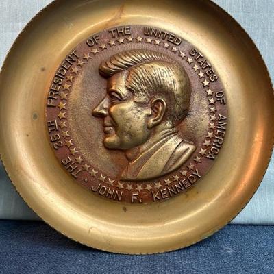 Lot 46, JFK metal plated bust 8 1/2 inches tall and JFK metal plate 10 inches