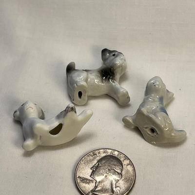 GROUP OF 3 TINY DOG FIGURINES- 2 PORCELAIN, 1 BISQUE
