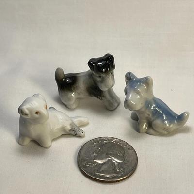 GROUP OF 3 TINY DOG FIGURINES- 2 PORCELAIN, 1 BISQUE