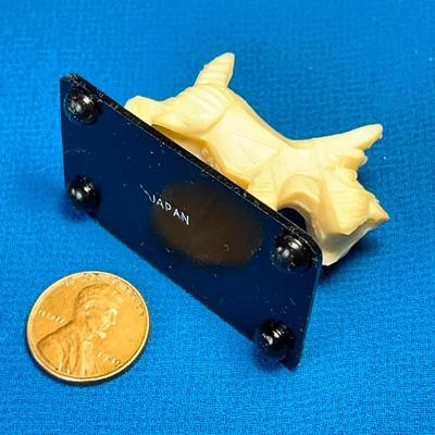 PAIR OF LITTLE CARVED WHITE SCOTTIE DOG FIGURINES ON STAND