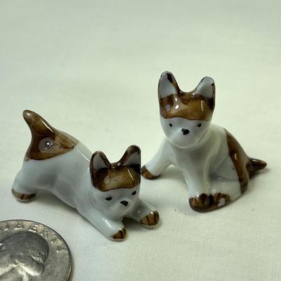PAIR OF LITTLE PORCELAIN DOG FIGURES