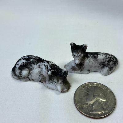 PAINTED BISQUE PAIR OF RECLINING DOG FIGURES