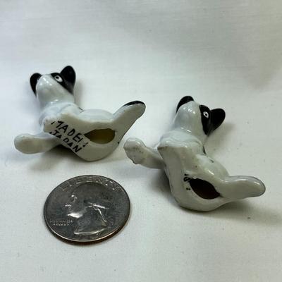 PAIR OF BLACK AND WHITE CERAMIC DOG FIGURES MADE IN JAPAN