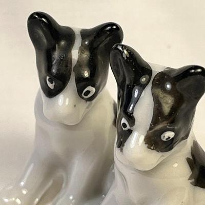 PAIR OF BLACK AND WHITE CERAMIC DOG FIGURES MADE IN JAPAN