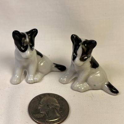 PAIR OF BLACK AND WHITE CERAMIC DOG FIGURES MADE IN JAPAN
