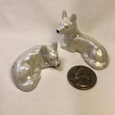 PAIR OF RECLINING DOG FIGURES w/ PEARLESCENT GLAZED FINISH