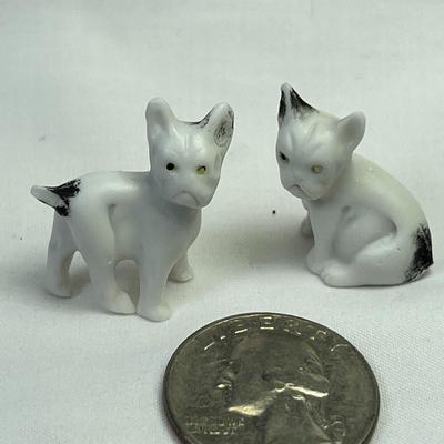 PAIR OF TINY PAINTED BISQUE DOG FIGURES