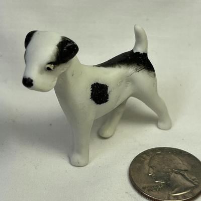BLACK AND WHITE BISQUE DOG FIGURINED