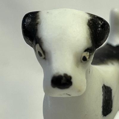 BLACK AND WHITE BISQUE DOG FIGURINED