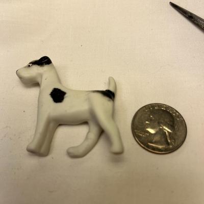 BLACK AND WHITE BISQUE DOG FIGURINED