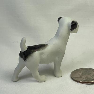 BLACK AND WHITE BISQUE DOG FIGURINED