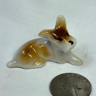 CERAMIC RECLINING DOG FIGURINE