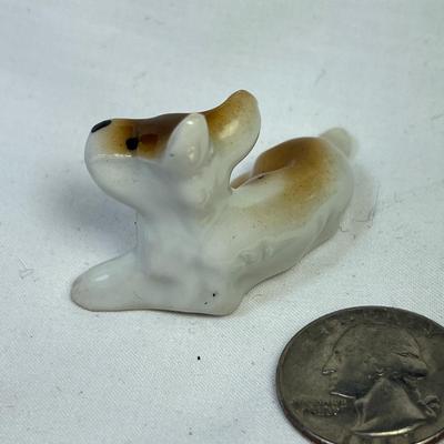 CERAMIC RECLINING DOG FIGURINE