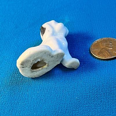 CERAMIC SITTING BLACK & WHITE DOG FIGURINE