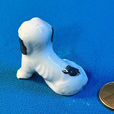 CERAMIC SITTING BLACK & WHITE DOG FIGURINE