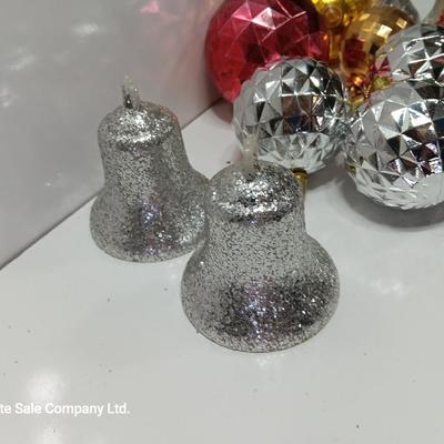 Variety of plastic Disco ball ornaments and plastic glittery bells