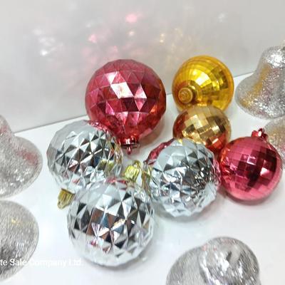 Variety of plastic Disco ball ornaments and plastic glittery bells