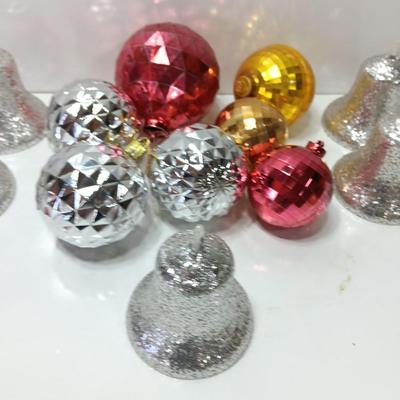 Variety of plastic Disco ball ornaments and plastic glittery bells