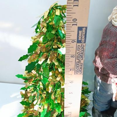 Large Santa building a snowman with plastic tinsel tree