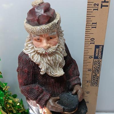 Large Santa building a snowman with plastic tinsel tree